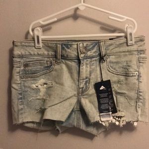 Woman’s short distressed jean shorts size 4